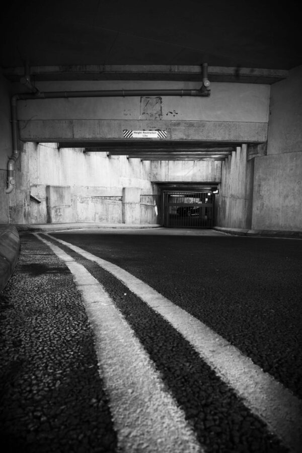 Bristol Street photography - High contrast Black and white images - double yellow lines going into a tunnel.