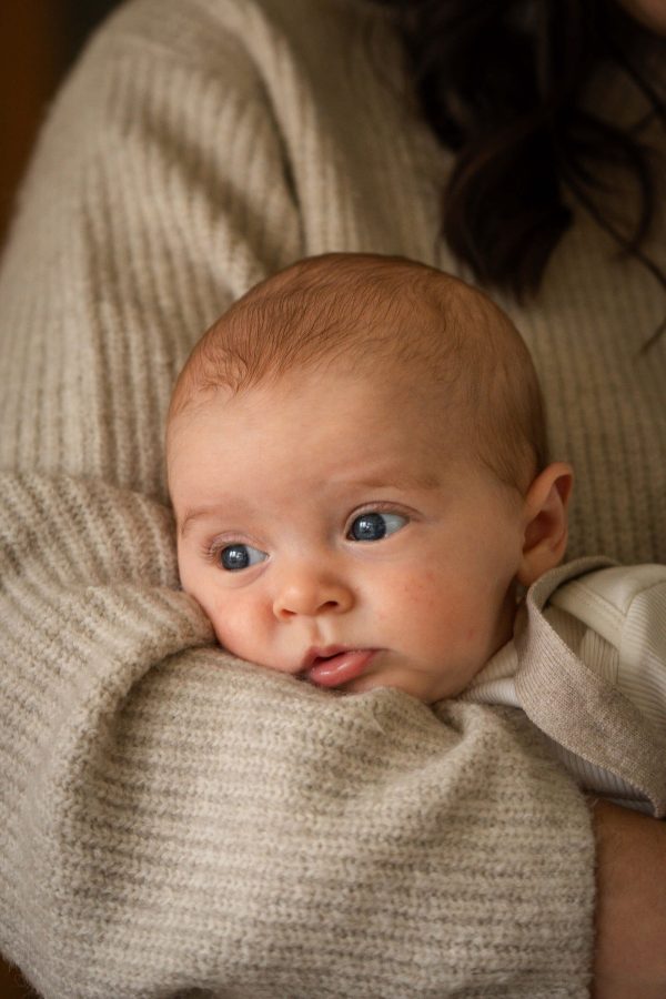 Baby in mother's arms.
