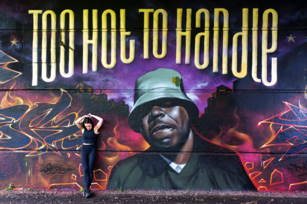 Portrait of a model in an urban street setting with graffiti background