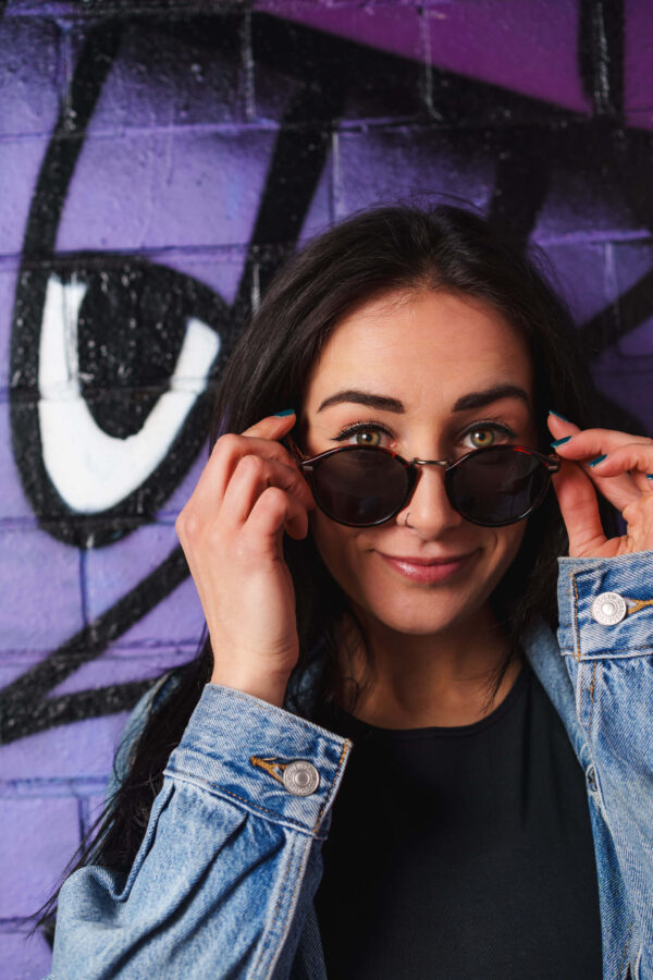 Portrait of a model in an urban street setting with graffiti background