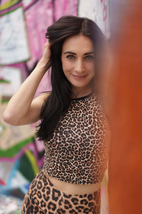 Portrait of a model in an urban street setting with graffiti background